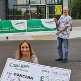 Richard Furey, managing director and David Sinclair, director, Yelo, with Dawn Weir, Concern Worldwide NI fundraising partnerships manager, outside the company’s premises in Carrickfergus.