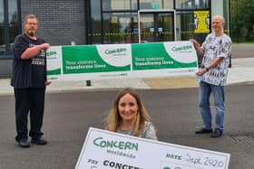 Richard Furey, managing director and David Sinclair, director, Yelo, with Dawn Weir, Concern Worldwide NI fundraising partnerships manager, outside the company’s premises in Carrickfergus.