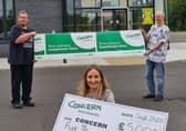 Richard Furey, managing director and David Sinclair, director, Yelo, with Dawn Weir, Concern Worldwide NI fundraising partnerships manager, outside the company’s premises in Carrickfergus.