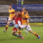 Ben Doherty battles with Motherwell's Allan Campbell in Europa League defeat last night for Coleraine. Pic by Pacemaker.