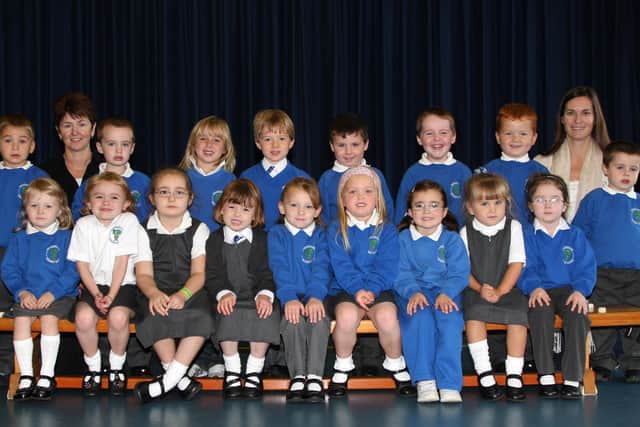 Mrs Ballentine’s P1 class at Broughshane Primary School are seen here with their teacher and Classroom Assistant Patricia Robinsosn. BT39-101JC