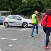 East Antrim MLA John Stewart assists with the crossing patrol at Carrickfergus Model Primary School.