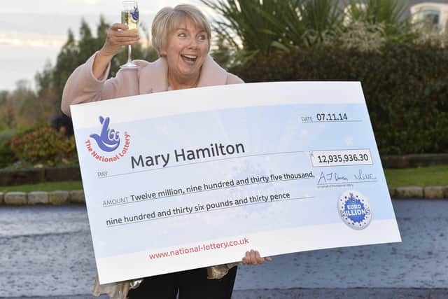 Belfast woman Mary Hamilton celebrates scooping a massive £12,935,936.30 jackpot in the Euromillions draw.