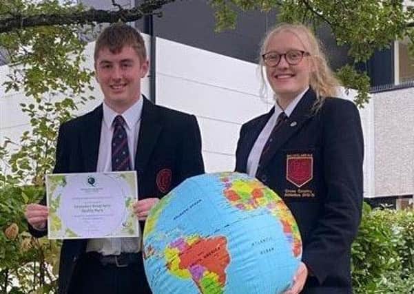Ballyclare High pupils Jamie McConnell and Olivia Boyd with the award.