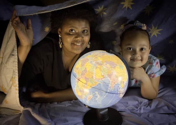 Ana Semedo and her daughter Maya enjoying bedtime stories from around the world delivered on Facebook by Clanmil Housing and CraicNI to mark Good Relations Week 2020.