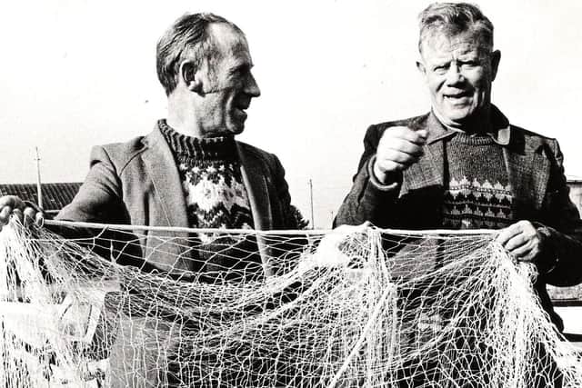 Two Lough Neagh fishermen tending to their nets in February 1982. Picture: News Letter archives