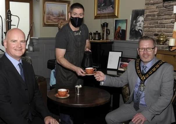 Mayor Kevin Savage, Economic Dev. and Regeneration Committee chair Cr Brian Pope and cafe owner Brian King