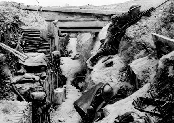 A British soldier keeping watch on 'No-Man's Land' as his comrades sleep in a captured German trench at Ovillers, near Albert, during the Battle of the Somme in the 1914-1918 First World War. Picture: PA Photo
