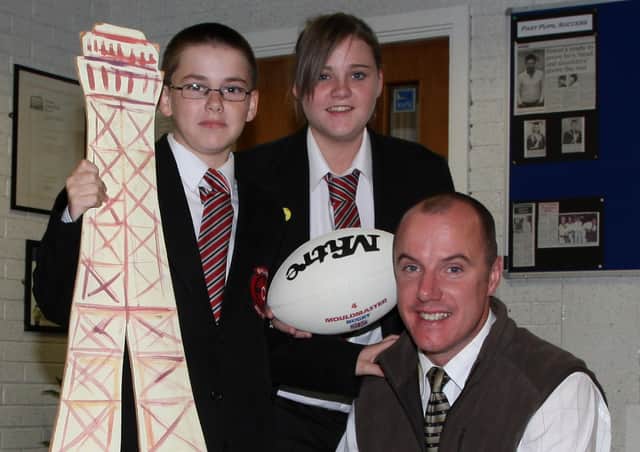 Ballee Community High School students Scott Young and Megan McClements and their teacher Mr Murdock who will join two students and staff from St Patrick’s College as part of the ‘Parlez-vouz rugby’ festival in France in October. BT39-171CS
