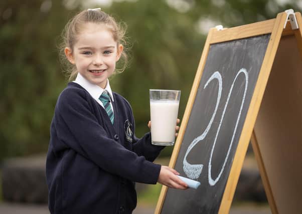 Abbie Lucas, a P2 pupil at Acorn Integrated Primary School, Carrickfergus, is all smiles as she helps the Dairy Council for Northern Ireland celebrate 20 years of World School Milk Day (Wednesday 30th September).  Picture by Brian Morrison.