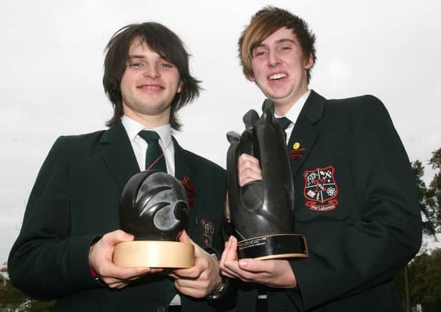 Tim Jackson and Glenn McGivern, Year 14 pupils at Cambridge House Grammar School, who won the Northern Ireland Final of the World Mental Health Day Inter-Schools Public Speaking competition. The boys beat very stiff competition from other regional finalists. Tim and Glenn, displaying their trophies from the event, received a free two day workshop at Cinemagic, a £50 HMV voucher and and a certificate from the Royal College of Psychiatrists. BT43-218AC