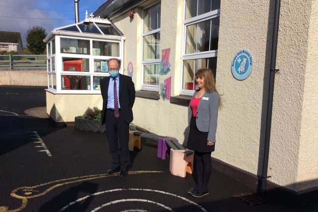 Education Minister Peter Weir is welcomed to Carnalbanagh Primary School by principal Alison Killough.
