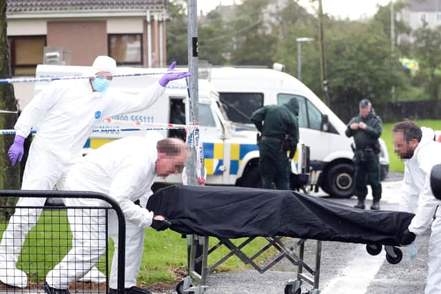 The body of a man is moved from a flat in the Crebilly Road area of Ballymena, Co Antrim.