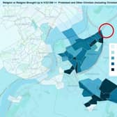 The attached image shows in blue the spread of Protestants in the city (with darker blue representing higher numbers), and the site of the development marked in red