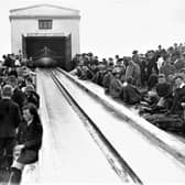 Townsfolk eagerly await practice launch of the Lifeboat Hopwood at the Boathouse and Slipway at Lansdowne. Circa 1912