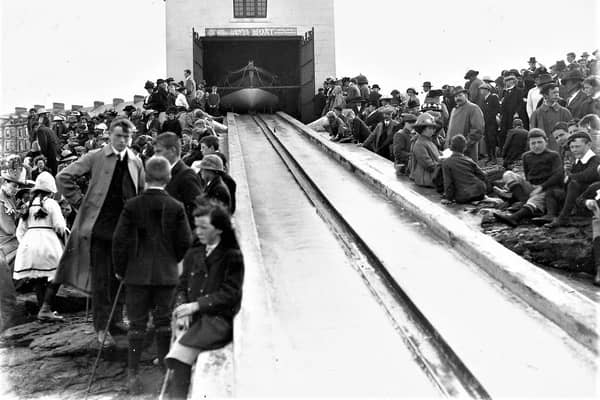 Townsfolk eagerly await practice launch of the Lifeboat Hopwood at the Boathouse and Slipway at Lansdowne. Circa 1912