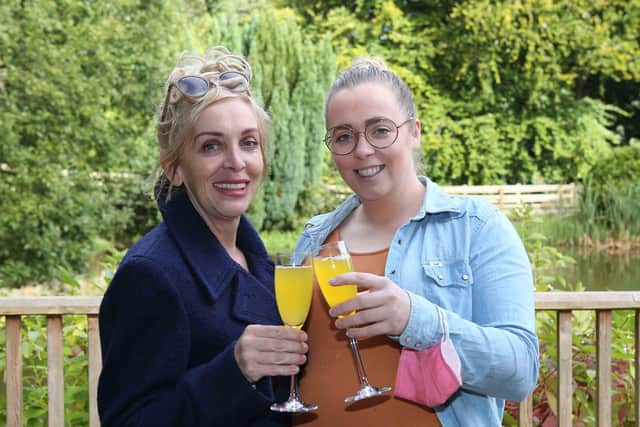 National Lottery winner Anne Canavan and daughter Cressida made an emotional return to the Beech Hill Country House Hotel where five years earlier, it was announced that Anne had won a life-changing £1M on EuroMillions