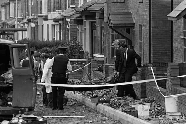 1987:

BODY OF UDR PART-TIME MEMBER JOHN TRACEY BEING REMOVED FROM HOUSE  AFTER HE WAS SHOT DEAD BY THE IRA ON A BUILDING SITE