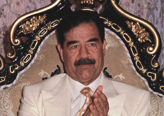 Iraqi President Saddam Hussein on his 61st birthday in 1998. AP Photo/INA, POOL, file