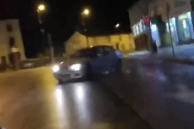 Footage showing a vehicle skidding across lanes in The Square area of Ballyclare.