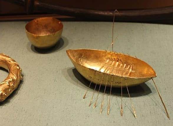 Gold boat, cup and bracelet, part of the Broighter hoard on display in Dublin's National Museum