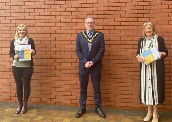 Lord Mayor of Armagh, Banbridge and Craigavon Councillor Kevin Savage with Stephanie Rock, Age Friendly Officer and Faye Aiken, ABC Seniors Network as they launch the new ABC Seniors Newsletter during Positive Ageing Month.