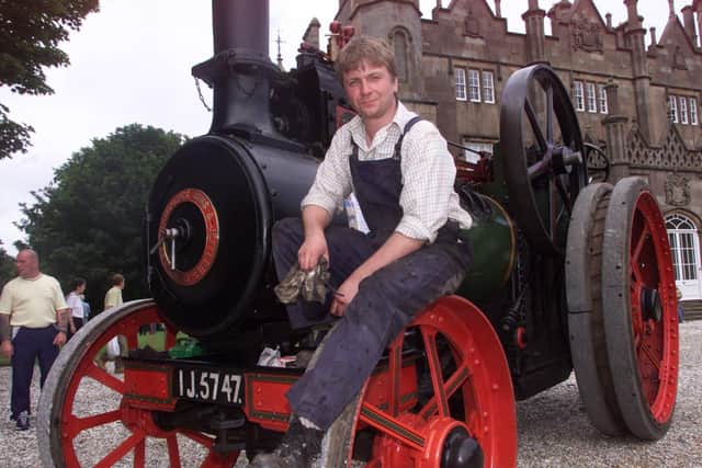 Simon Dundee from Glengormley brought his 1922 Ransomes Sims and Jefferies traction engine to Glenarm Castle for a rally in July 2002. Picture: Mark McCormick/News Letter archives