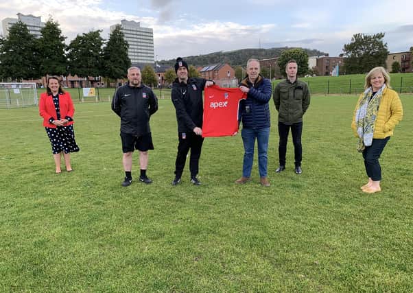 Cllr Linda Irwin and Paula Bradley MLA joined representatives from APEX Housing to present Rathcoole Football Club with their new kit.