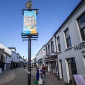 Banner designs created by local artists telling the story of the area and promoting the importance of ‘Shop Eat Enjoy Local are welcoming visitors to Limavady after being selected following a public art competition