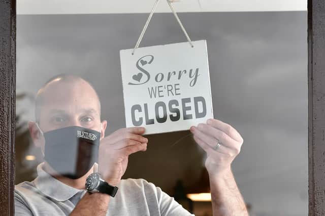 Gary Monteith from Blethers Cafe on the Cregagh Road in East Belfast Closes his doors yesterday. Restaurants and cafes closed their doors to sit-in customers from 6pm yesterday as NI is put under stricter Covid-19 restrictions.

Pic Colm Lenaghan Pacemaker