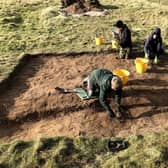 The Higgins family in Trench 2 excavating the cremelated fire trench