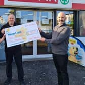 Jackie Fenton and Ronnie Eynon, from Spar Craigyhill, presenting Conor O’Kane, Marie Curie, with a cheque for £2,100 from the store's recent fundraising.