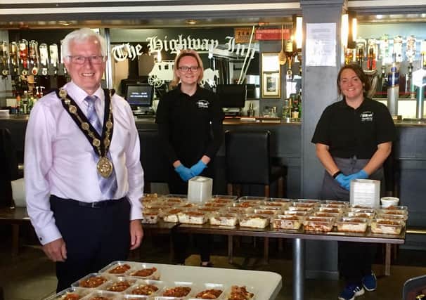 Mayor of Lisburn & Castlereagh City Council, Cllr Alan Givan, Chelsea Brown (Soup Kitchen Volunteer / Assistant Manager of The Highway Inn Bar & Kitchen) and Emma Robb (Soup Kitchen Manager / Manager of The Highway Inn Bar & Kitchen)
