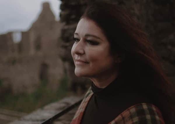 Carolyn Dobbin at Dunluce Castle filming 'Northern Songs' with NI Opera.