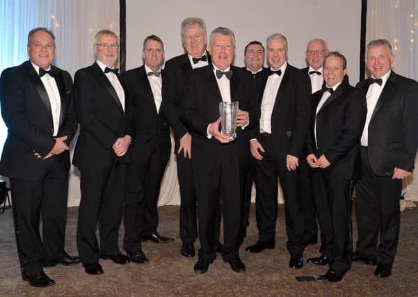 Terence Donnelly, front centre, winner of the Lifetime Achievement Award pictured with company staff at the awards night last year. INMU48-252.