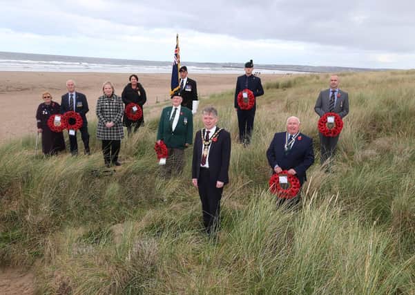 Mayor of Causeway Coast and Glens Borough Council, Alderman Mark Fielding and Council's Veterans Champion, Councillor Michelle Knight McQuillan meet with representatives from the Dunboe branch of the Royal British Legion at Castlerock Beach