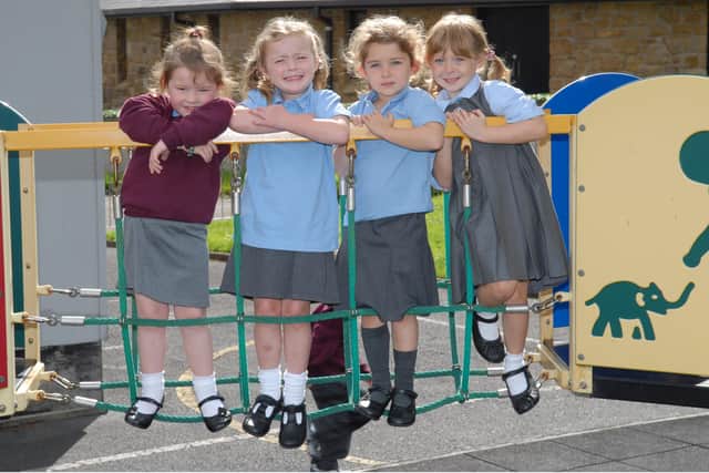 Emma, Katie, Beth and Michelle having fun in the play area at St John's Primary School, Carnlough. LT37-365-PR