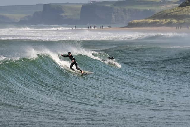 Ethan Hill and his dad Andy rode the waves at East Strand for more than five hours yesterday. Picture: andyhillphotography