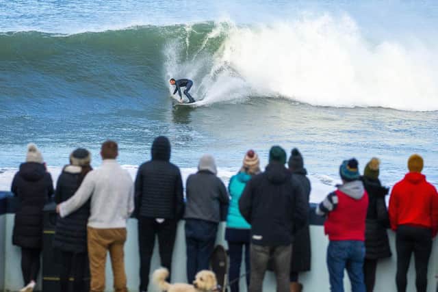 Crowds gather at Portrush's East Strand to watch surfers riding some of the biggest waves the north coast has ever seen. 

Picture by Jonathan Porter/PressEye