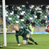 Andy Waterworth broke the deadlock with a slick penalty kick past Crusaders’ Sean O’Neill. Pic by Pacemaker.