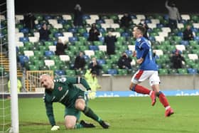 Andy Waterworth broke the deadlock with a slick penalty kick past Crusaders’ Sean O’Neill. Pic by Pacemaker.