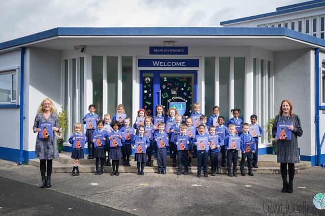 Primary Two pupils at St Comgall’s school in Antrim are flying high with a special book delivery from Belfast
International Airport.