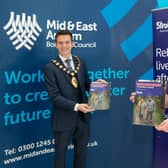 Mid and East Antrim Mayor, Cr Peter Johnston receives the new Stroke Association manifesto from Mark Dyer