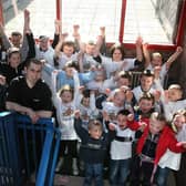 Stephen Clarke, proprietor of Streat Café, Strand Road, Londonderry, who sponsored a trip by pupils at The Fountain Primary School, to see the Belfast Giants ice-hockey team compete in The Odessy, Belfast, gets a ‘big cheer’, before the pupils leave by bus for Belfast.  LS13-531MT.