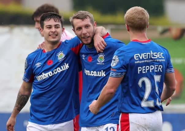 Kirk Millar (centre) finished with a goal and assist for Linfield against Portadown. Pic by Pacemaker.