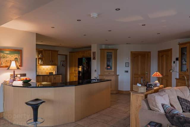 The property features a kitchen/open plan breakfast/living area