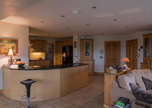 The property features a kitchen/open plan breakfast/living area