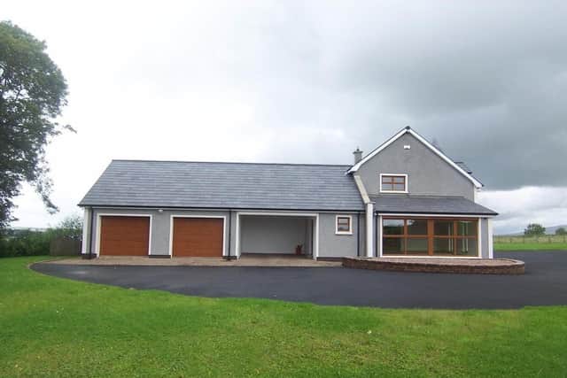 The property has an integral double garage and car port