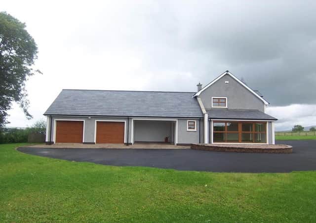 The property has an integral double garage and car port