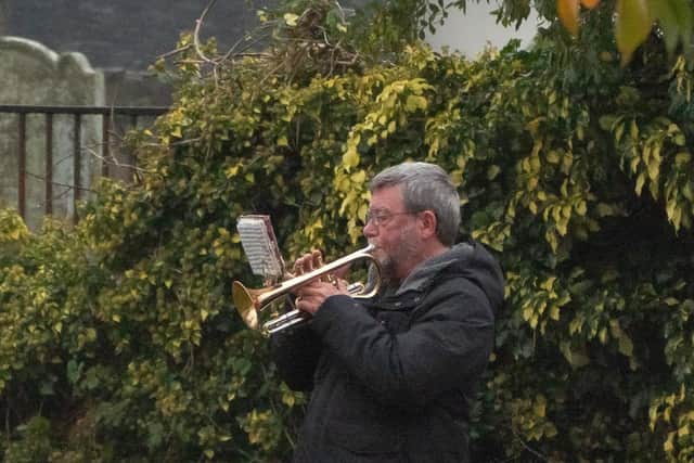 A bugler plays the Last Post at Larne war memorial on Remembrance Sunday.